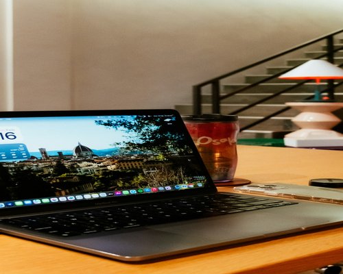 person working on a laptop at home in Italy
